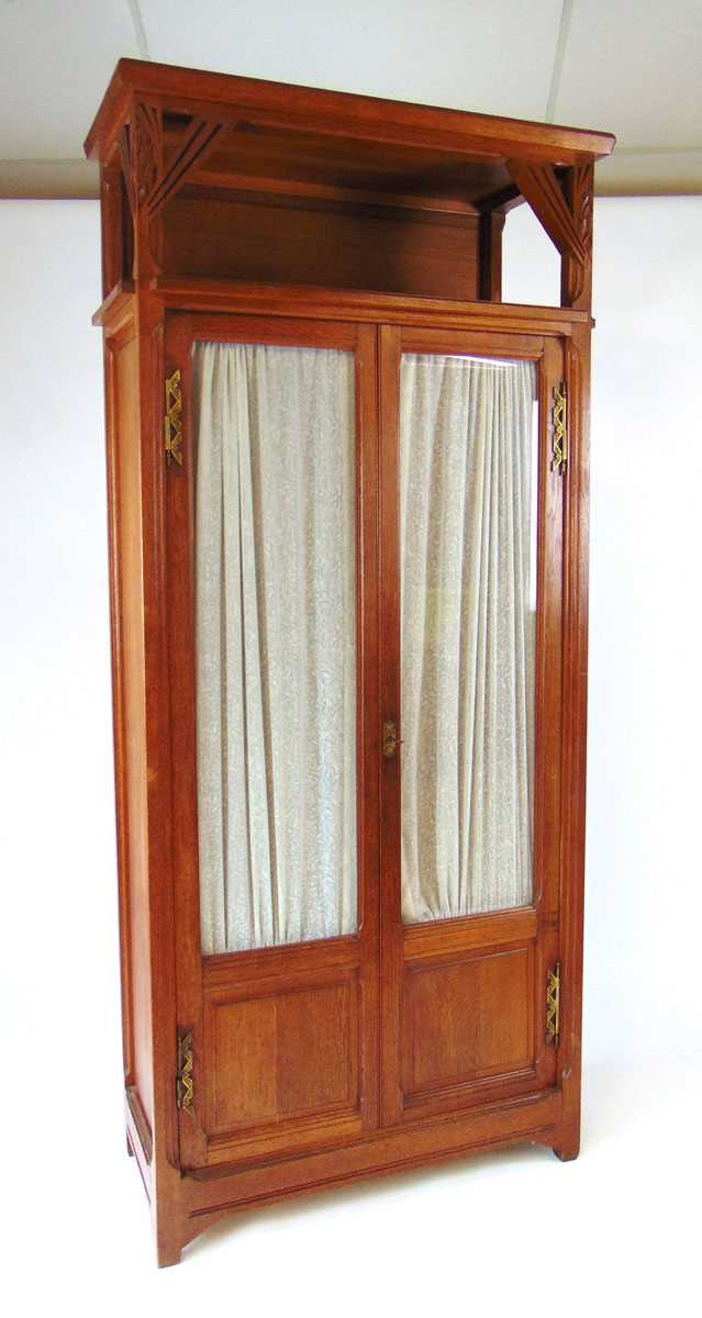 An early 20th century continental oak Art Deco display cabinet, with carved stylised leaves and - Image 3 of 3