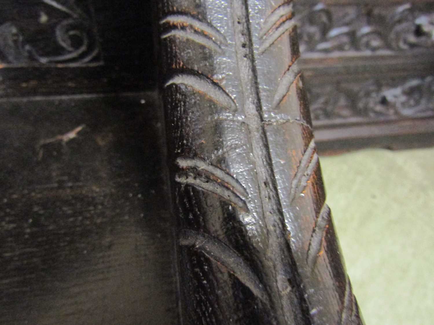 A late Victorian carved and ebonised oak purdonium/seat, decorated with carved masks, foliate - Image 8 of 14