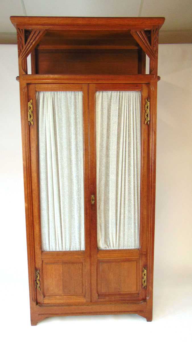An early 20th century continental oak Art Deco display cabinet, with carved stylised leaves and - Image 2 of 3
