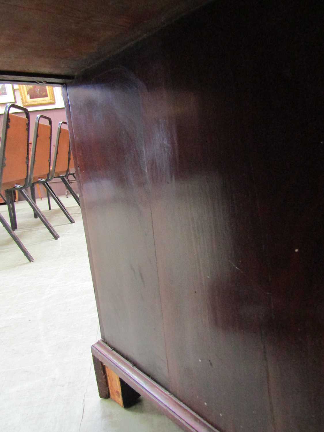 A George III mahogany desk, the top with applied moulded edge, above a long drawer fitted with a - Image 16 of 17