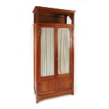 An early 20th century continental oak Art Deco display cabinet, with carved stylised leaves and