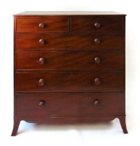 An early 19th century mahogany chest of drawers, with two short over four long graduated oak lined