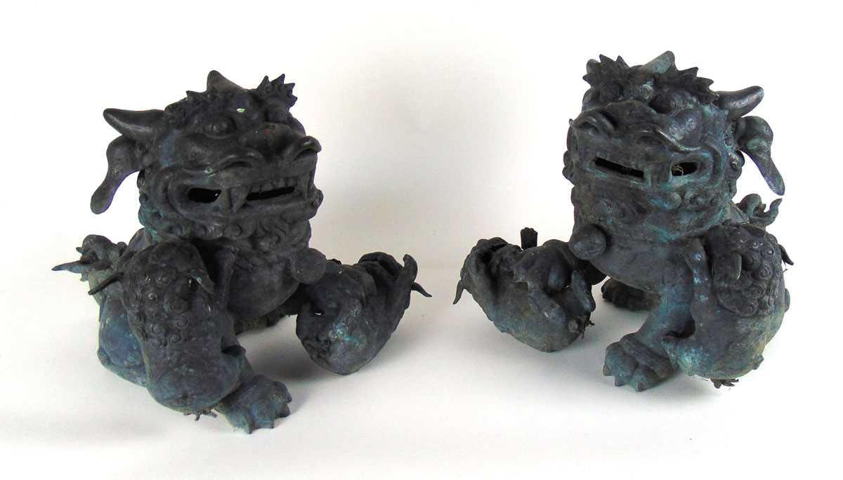 A pair of Chinese bronze Dogs of Fo with pups, early 20th century, a playful pup either under a