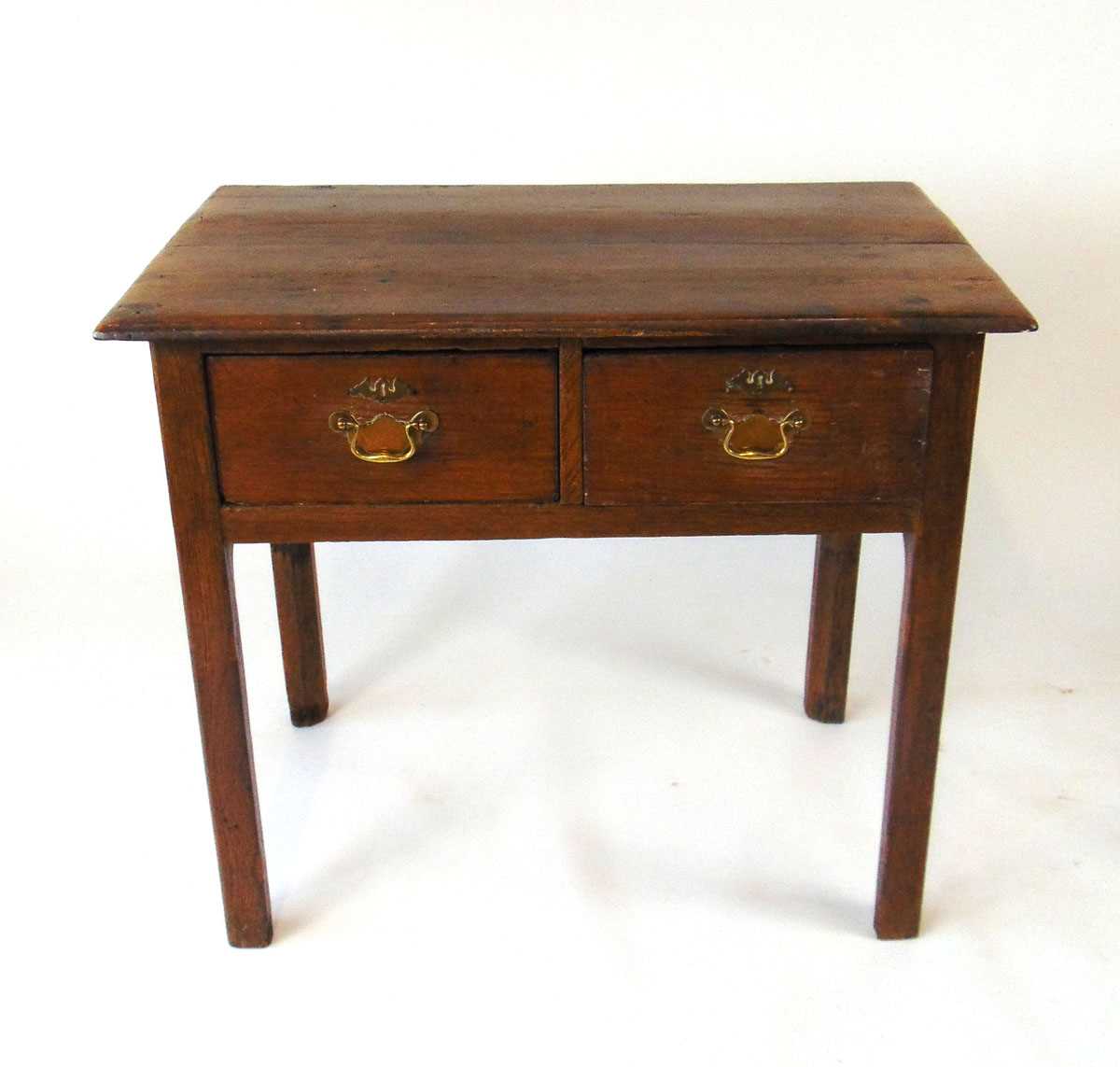An 18th century oak side table, the two plank top with moulded edge over two drawers, on square