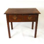 An 18th century oak side table, the two plank top with moulded edge over two drawers, on square