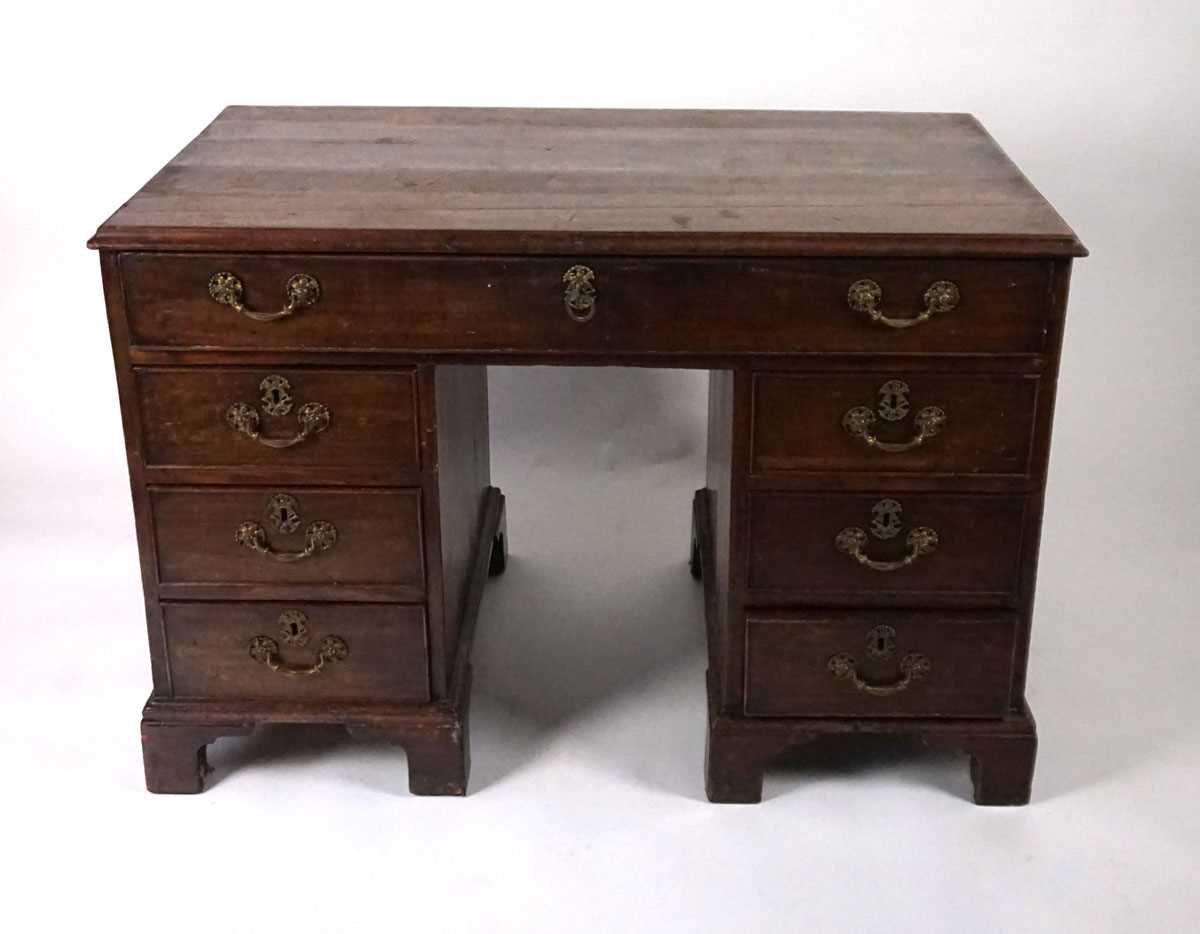 A George III mahogany desk, the top with applied moulded edge, above a long drawer fitted with a - Image 2 of 17