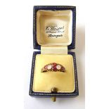 A mid-Victorian 15ct gold, garnet and moonstone ring with engraved shank. Size N. Approx. weight 1.
