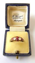 A mid-Victorian 15ct gold, garnet and moonstone ring with engraved shank. Size N. Approx. weight 1.