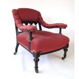 An Aesthetic period armchair, the part gallery back with turned spindles and shallow carved