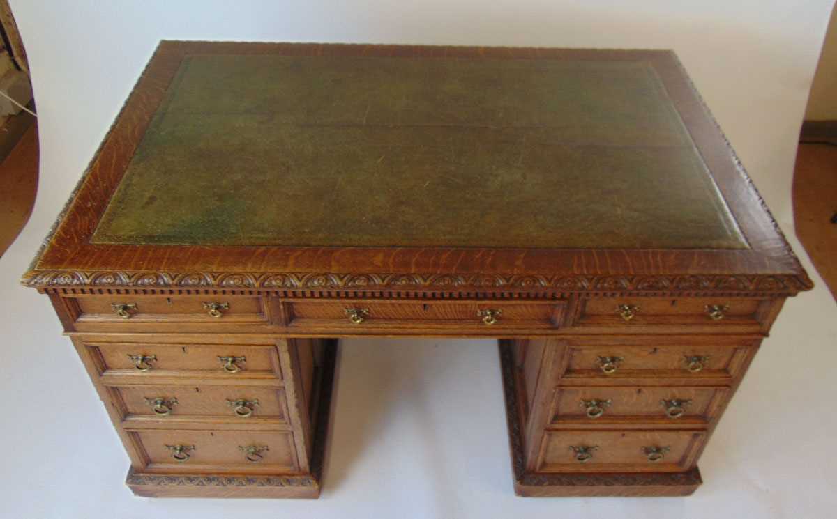 A late Victorian oak partners desk, with green tooled leather writing surface, above a series of - Image 5 of 15