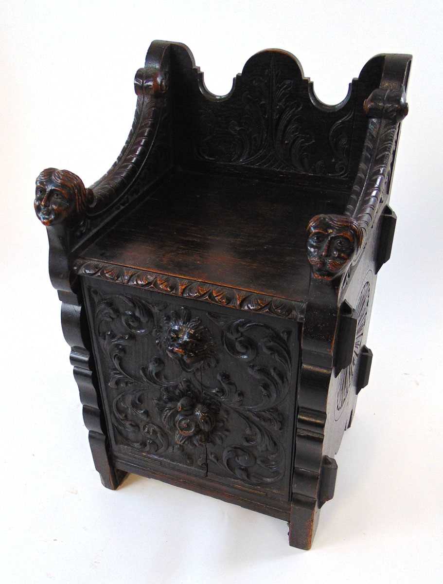 A late Victorian carved and ebonised oak purdonium/seat, decorated with carved masks, foliate - Image 3 of 14