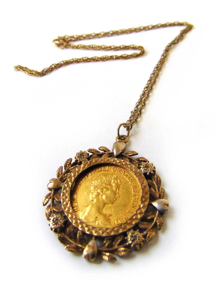 A 1982 half sovereign mounted in a 9ct gold surround with chain. Approx. weight 9g - Image 2 of 2