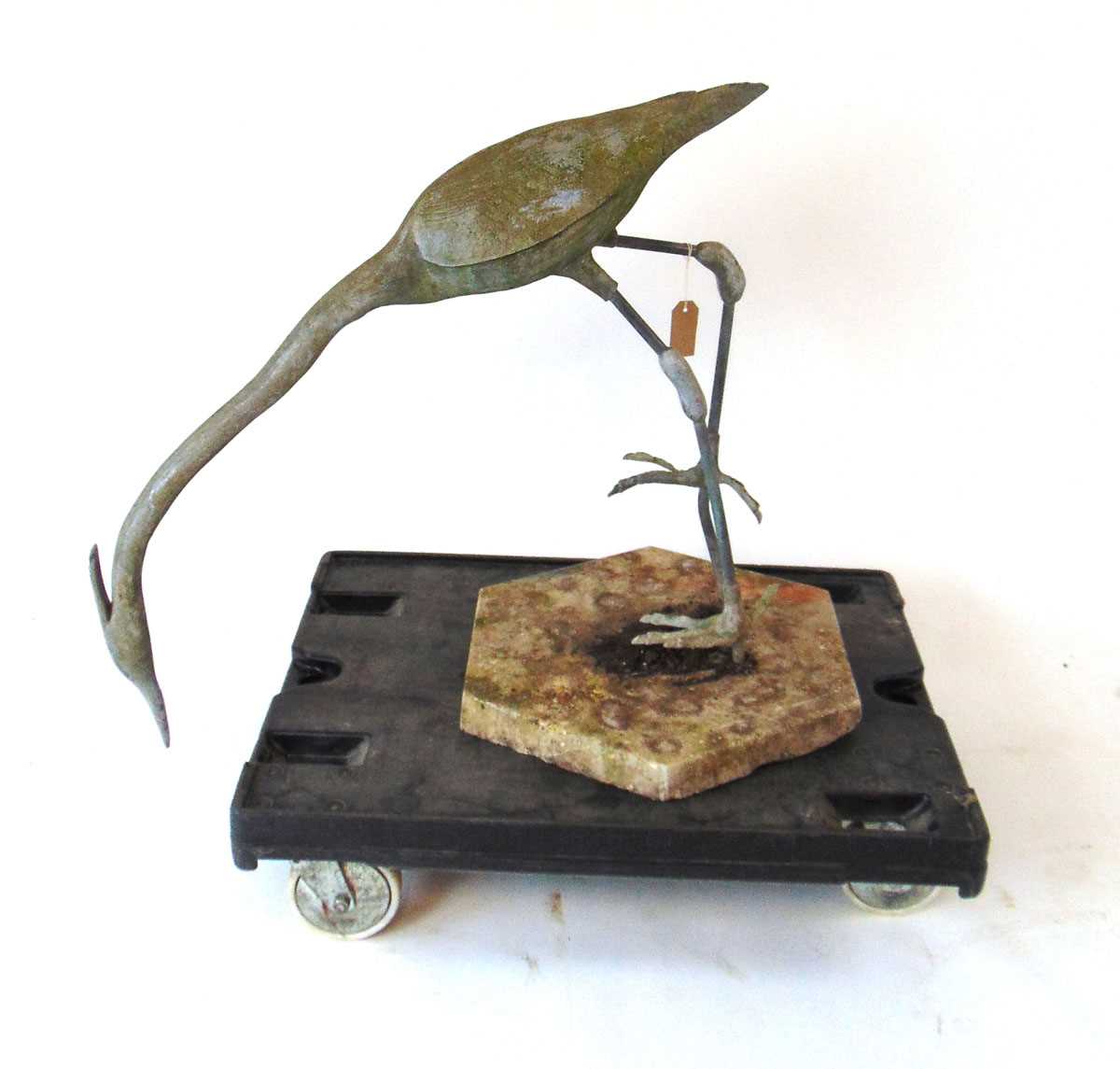 A life size lead Heron garden ornament, modelled facing downwards, on a concrete base, 88cm wide , - Image 2 of 4