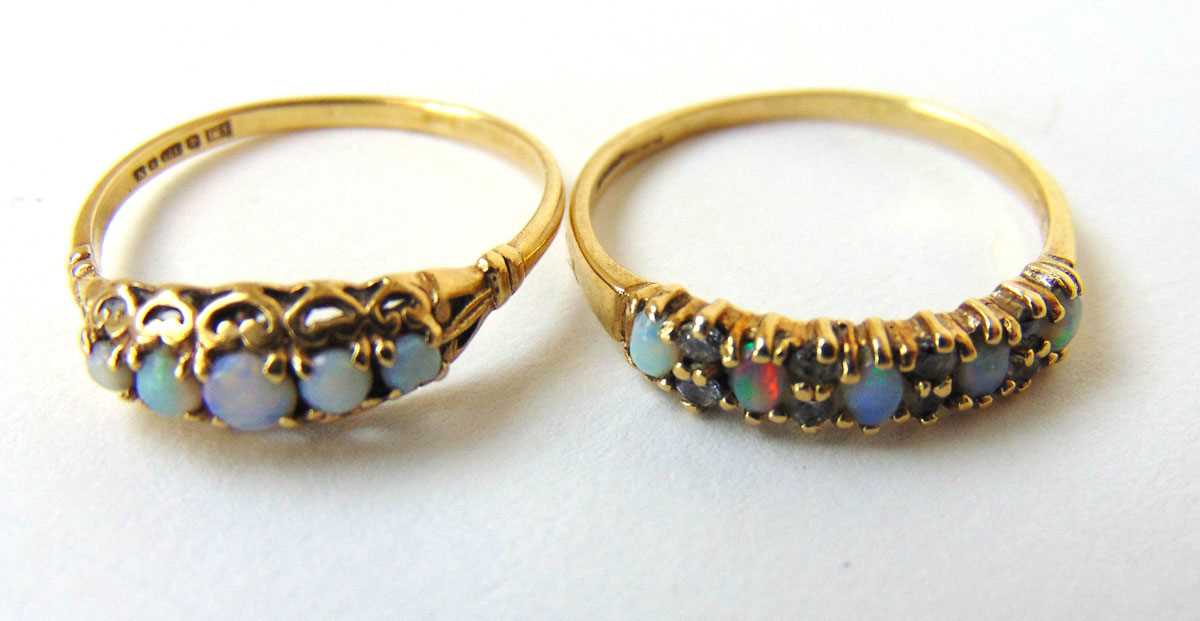 A 9ct gold opal and CZ dress ring together with one similar opal ring. Approx. weight 2.8g Sizes: