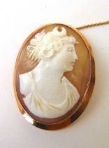 An early 20th century yellow metal mounted cameo brooch marked '9ct'. Approx. weight 10.7g A/F