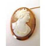 An early 20th century yellow metal mounted cameo brooch marked '9ct'. Approx. weight 10.7g A/F