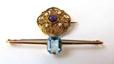 An early 20th century amethyst and seed pearl brooch of openwork design together with yellow metal