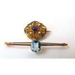 An early 20th century amethyst and seed pearl brooch of openwork design together with yellow metal