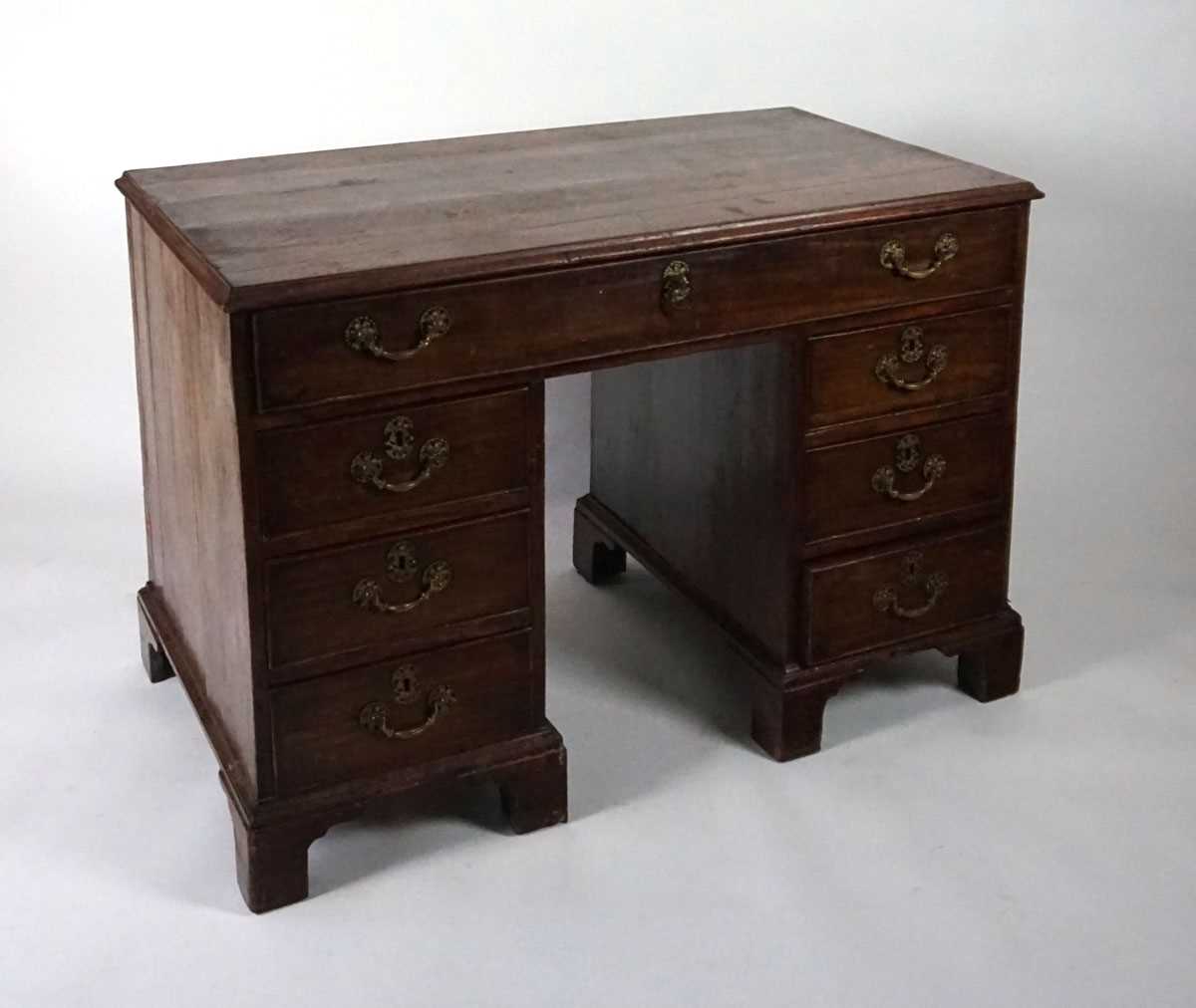 A George III mahogany desk, the top with applied moulded edge, above a long drawer fitted with a - Image 4 of 17