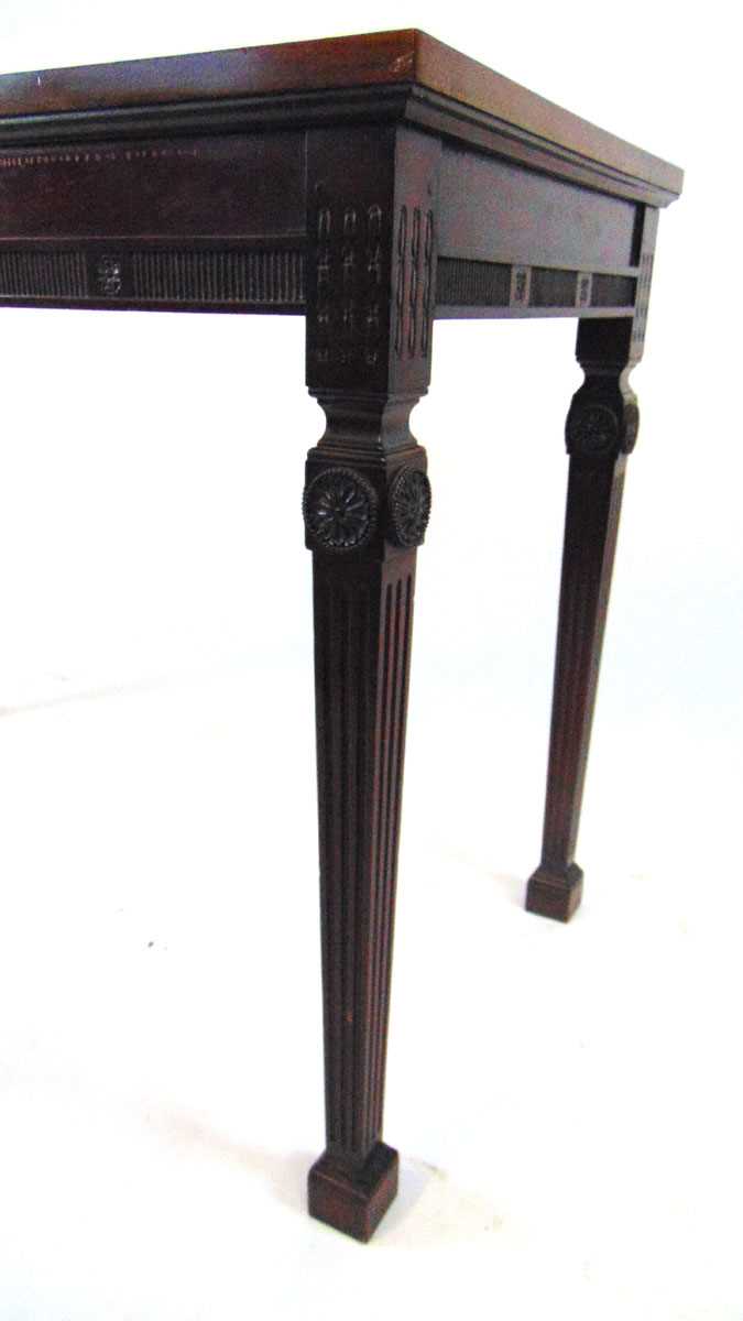 An Edwardian classical revival mahogany side table, of rectangular form, on square fluted legs on - Image 2 of 5