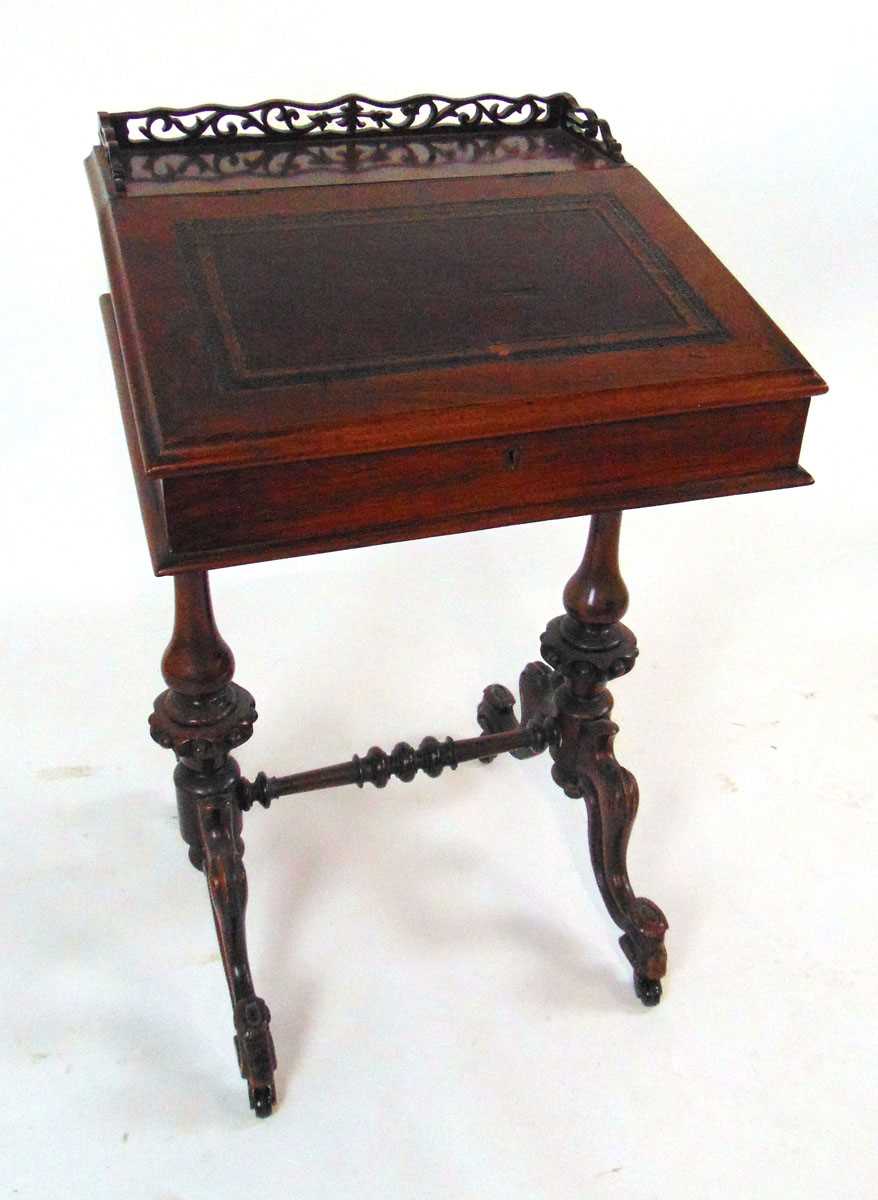 A Victorian rosewood Davenport, with fretwork gallery above a tooled red leather writing surface, - Image 4 of 7