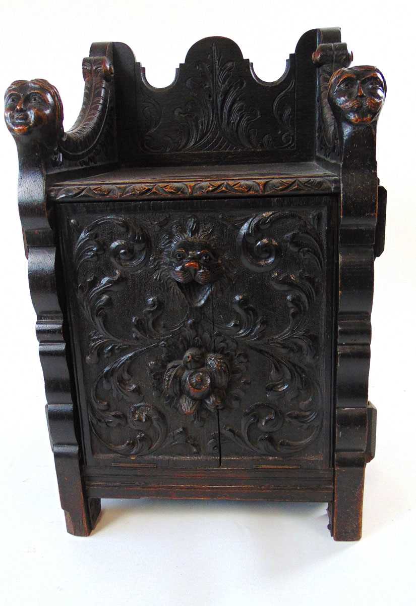 A late Victorian carved and ebonised oak purdonium/seat, decorated with carved masks, foliate - Image 4 of 14