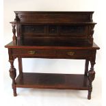 A late Victorian oak buffet, with blind fretwork decoration., a long frieze drawer, with bulbous cup