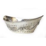 A silver navette shape basket, Hendeles & Co, London 1913, with pierced decoration and embossed lion