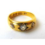 A Victorian 18ct gold and three stone diamond gypsy ring, the approximately 0.25ct central old cut