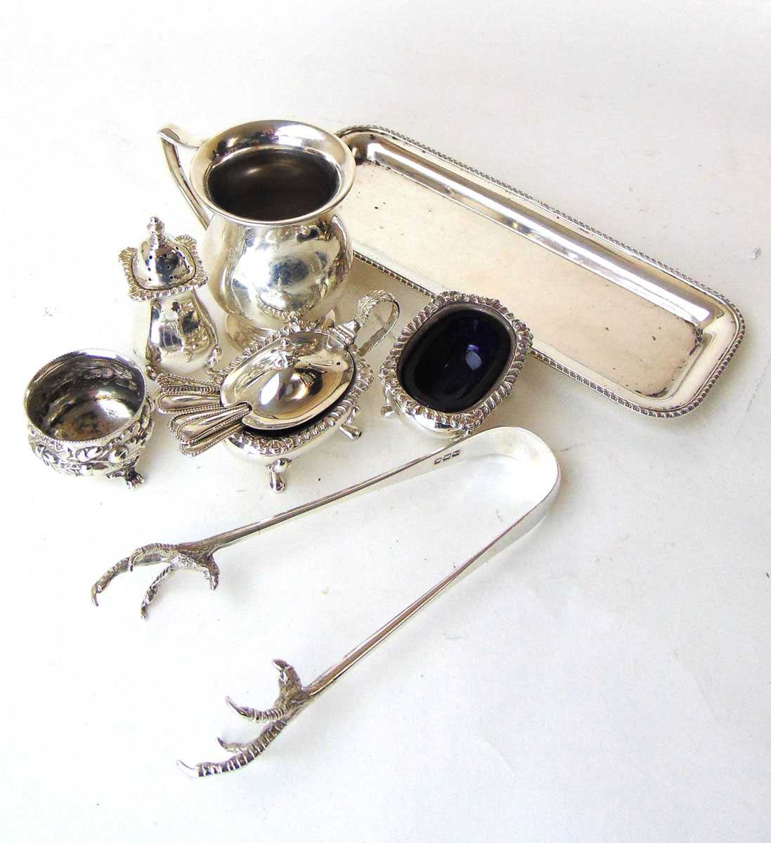 A matched silver cruet set with spoons, Albert Ernest Jones, Birmingham 1966 & 1972; a pair of