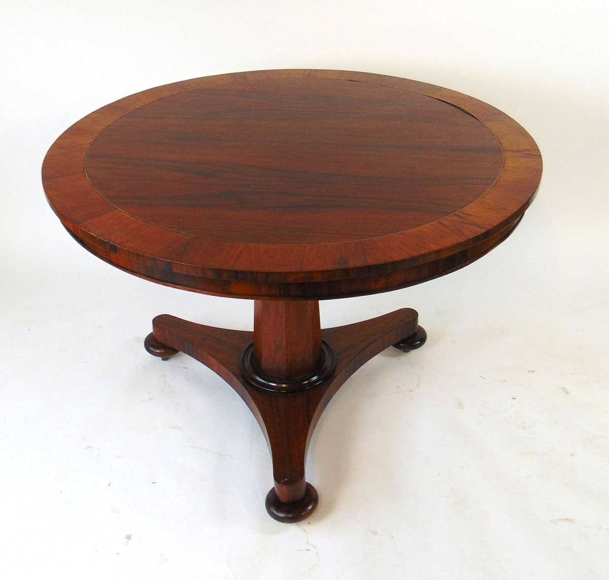 A 19th century rosewood tilt top table, with crossbanded edge and brass stringing, on an octagonal - Image 3 of 4