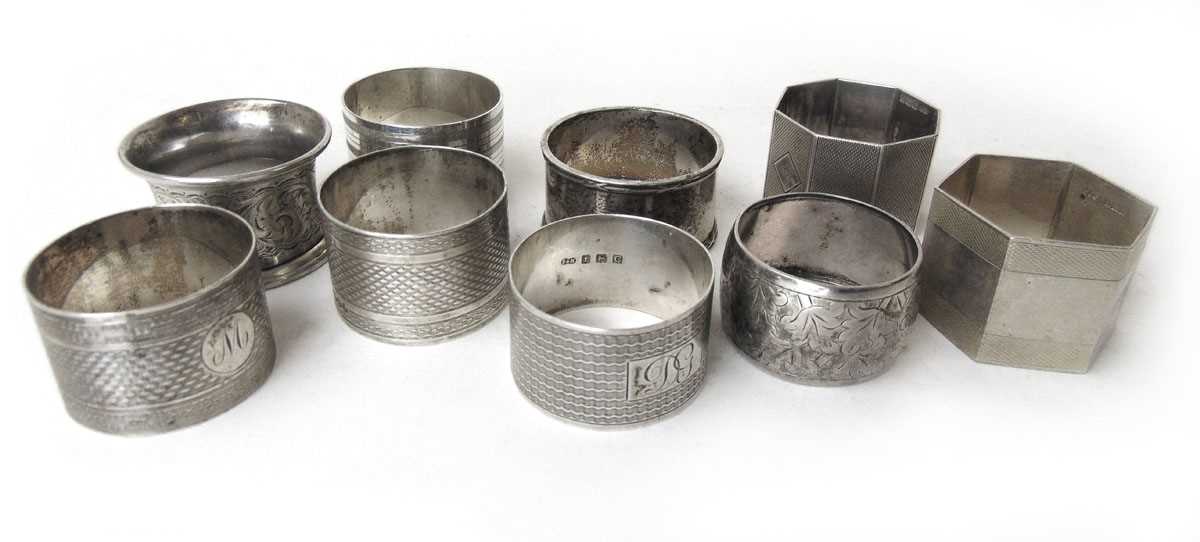 Nine sterling silver napkin rings, various dates & makers, 289g