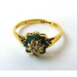 An 18ct gold, diamond and emerald cluster ring. Size N 1/2. Approx. weight 2.4g
