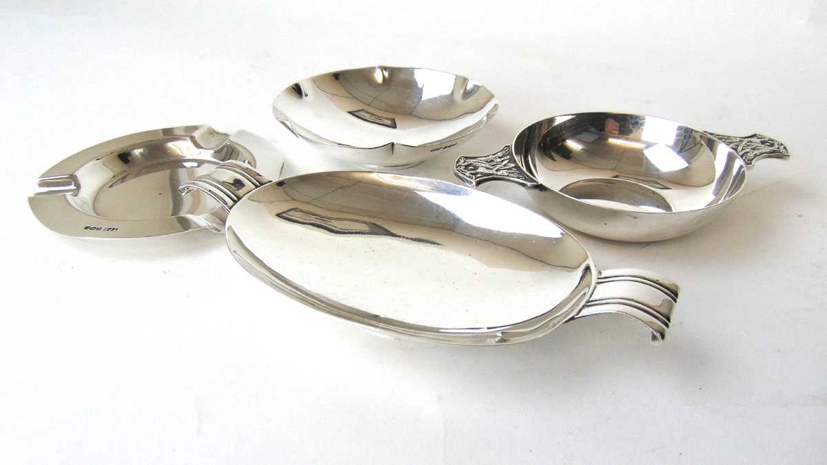 A George VI silver quaich together with three silver pin dishes/ashtrays. Various hallmarks. Approx. - Image 2 of 2