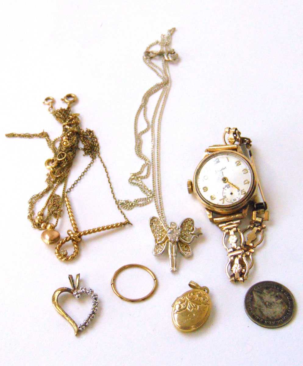 An assortment of 9ct gold, yellow metal and silver jewellery to include a 9ct gold cased watch,