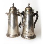 An Elizabeth II silver coffee pot together with a matching silver teapot. Hallmarked for London