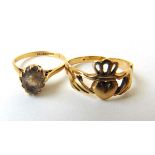 A 9ct gold and smokey quartz dress ring together with a 9ct gold Claddagh ring. Approx. weight 5.3g