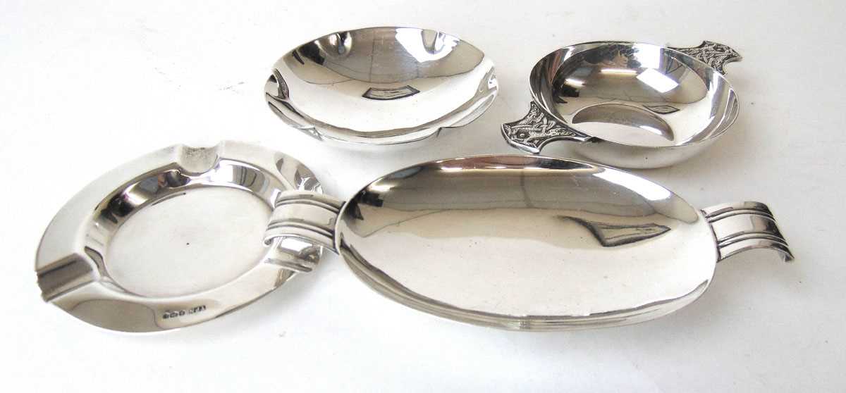 A George VI silver quaich together with three silver pin dishes/ashtrays. Various hallmarks. Approx.