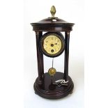 An early 20th century portico clock, with German movement, the dark stained body with brass acorn