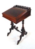 A Victorian rosewood Davenport, with fretwork gallery above a tooled red leather writing surface,