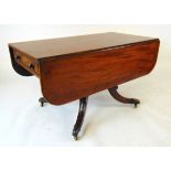 A 19th century mahogany and crossbanded breakfast table, the drop leaves with rounded corners,