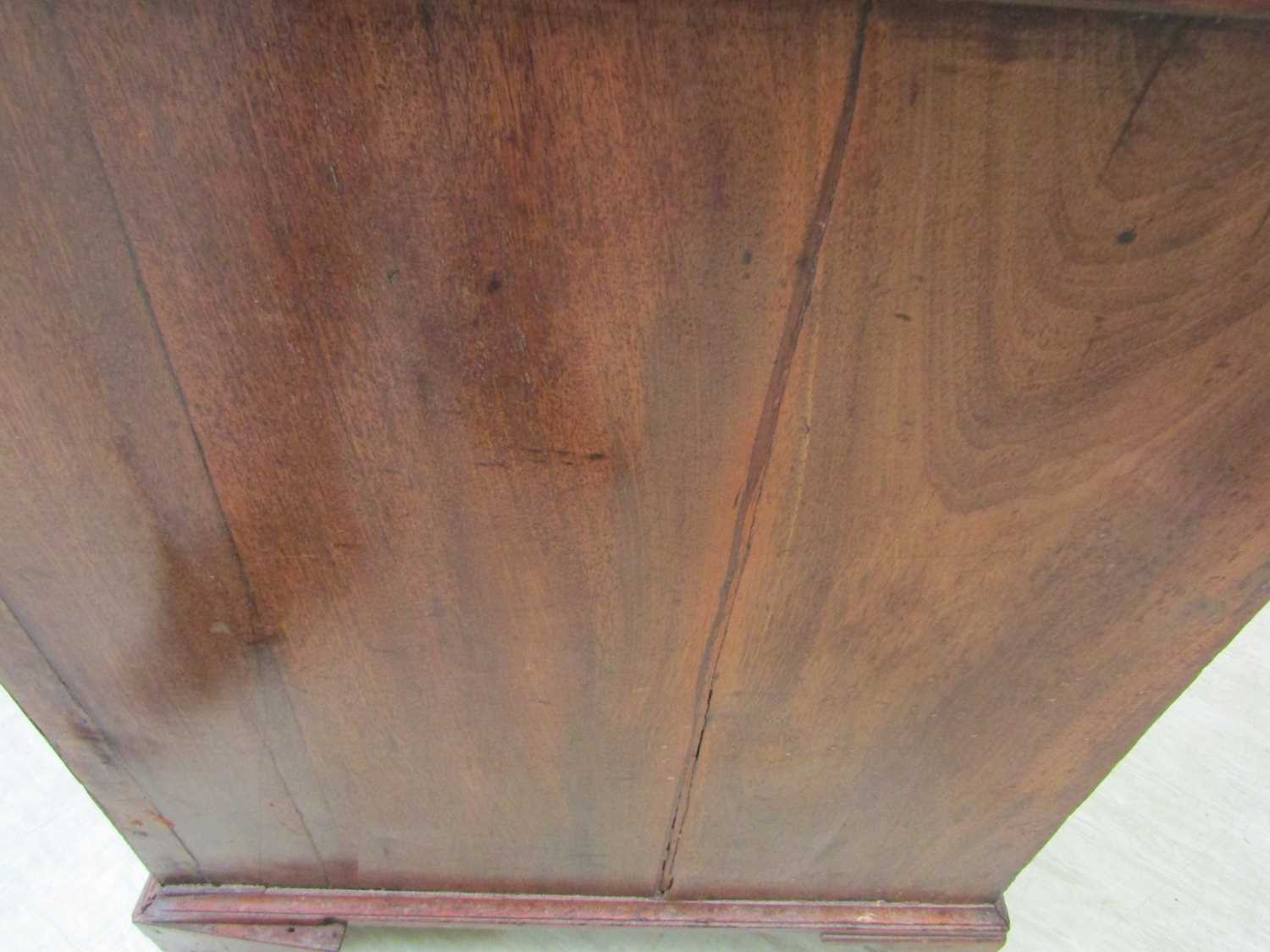 A George III mahogany desk, the top with applied moulded edge, above a long drawer fitted with a - Image 13 of 17