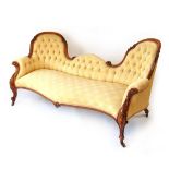 A Victorian conversation settee, with carved mahogany show frame, with horsehair and sprung filling,