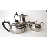 A George V matched silver four-piece tea and coffee set. Various hallmarks, makers mark for S
