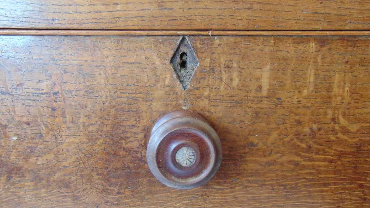 An 18th century oak dresser, with moulded pediment over three shelves and iron hooks, the base - Image 3 of 9