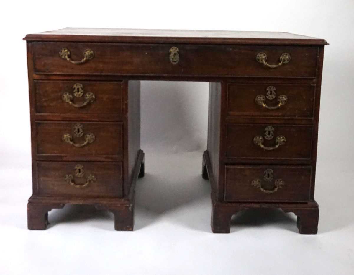 A George III mahogany desk, the top with applied moulded edge, above a long drawer fitted with a - Image 3 of 17