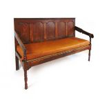 A George III oak settle, with five panel back, the shaped armrests on bobbin turned supports, with