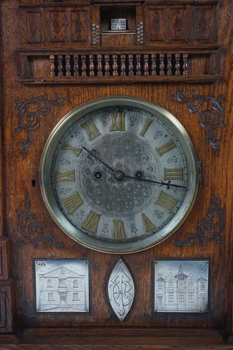 A late 19th century oak 'Church Organ' mantel clock. The top modelled as a pipe organ above reeded - Image 4 of 16