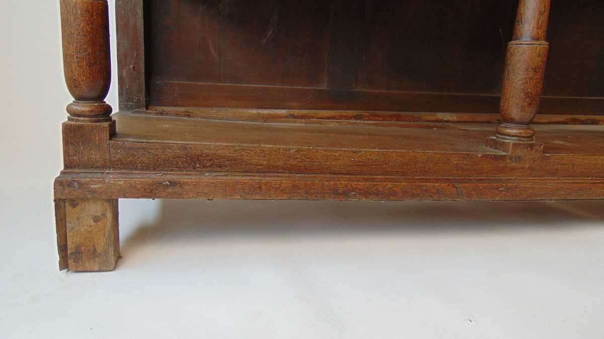 An 18th century oak dresser, with moulded pediment over three shelves and iron hooks, the base - Image 5 of 9