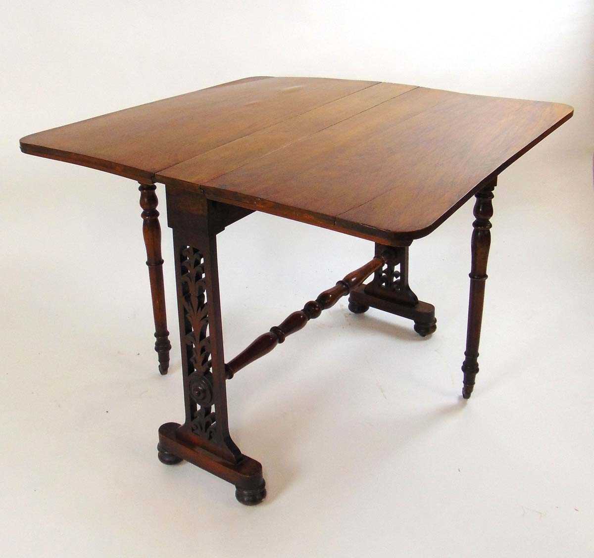 A Victorian rosewood Sutherland table, with elliptical drop leaves, on pierced foliate fretwork - Image 2 of 2